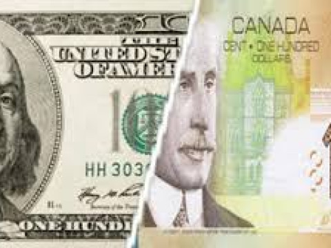 الدولار الكندي يحافظ على مكاسبه أمام نظيره الأمريكي