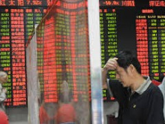 انخفاض الأسهم الصينية بالتزامن مع هبوط اليوان خلال تعاملات اليوم